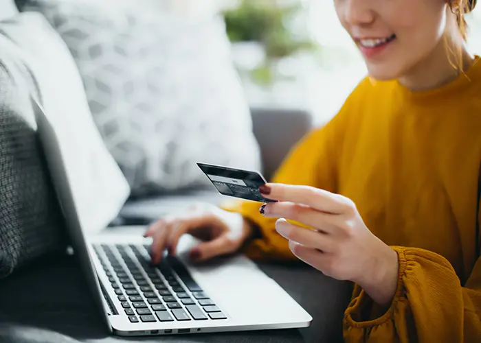 woman holding a credit card