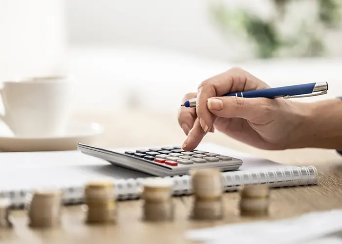 calculator and coins