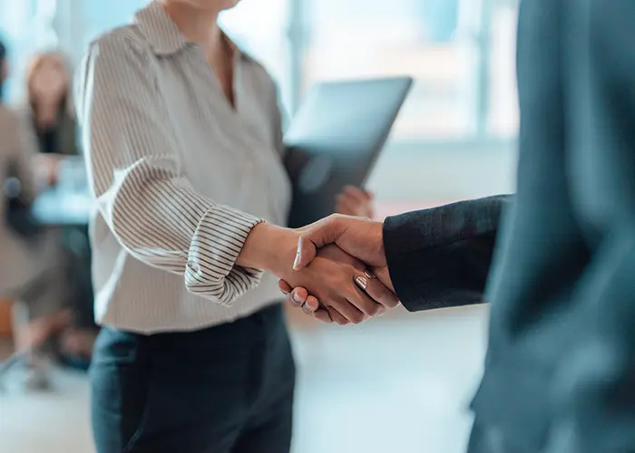 man and woman shaking hands